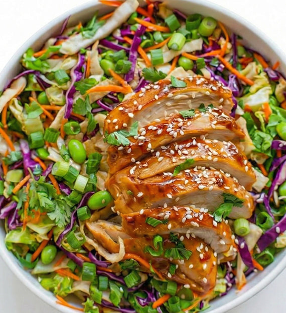 Asian Chicken Salad, with Roasted Chicken Breast, Red and Green Cabbage, Carrot, Scallion, Cilantro, Sesame Seeds, Gingered Tamari Vinaigrette