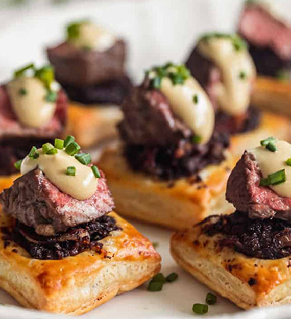 Beef Tenderloin, Caramelized Onion, Gruyere Cheese, and Horseradish Puff Pastry Tart