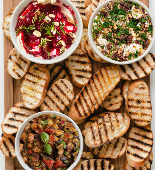Beautiful Bruschetta Bar. Create Your Own Bruschetta with Garlic and EVOO Grilled Italian Crostini, and Three Different Toppings