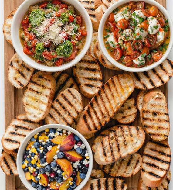 Beautiful Bruschetta Bar. Create Your Own Bruschetta with Garlic and EVOO Grilled Italian Crostini, and Three Different Toppings
