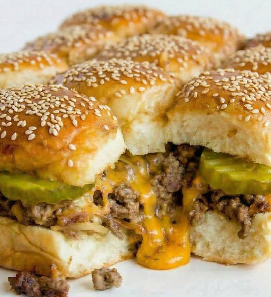 Pull Apart Cheeseburger Slider Bar – Warm, Pull Apart Burgers with Melty Cheddar Cheese, Caramelized Onion, Dill Pickle, and Creamy, Tangy Boom Sauce, Tucked Into Toasted Sesame Buns. Tray of 12 Burger Sliders.