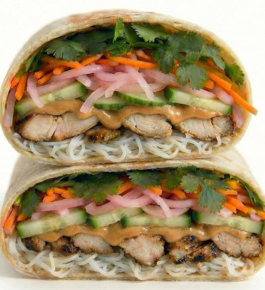 Chicken Banh Mi – Lemongrass Ginger Roasted Chicken, Rice Noodle Salad, Pickled Carrot and Red Onion, Cucumber, Fresh Cilantro and Mint, Sriracha Lime Aioli, Flour Tortilla