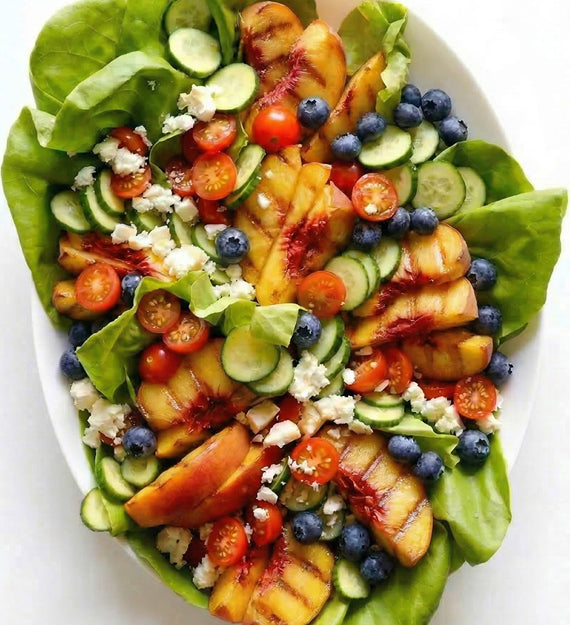 Grilled Peach and Blueberry Gem Lettuce Salad, with Goat Cheese, Hot House Cucumber, Red Onion, and Herb Vinaigrette