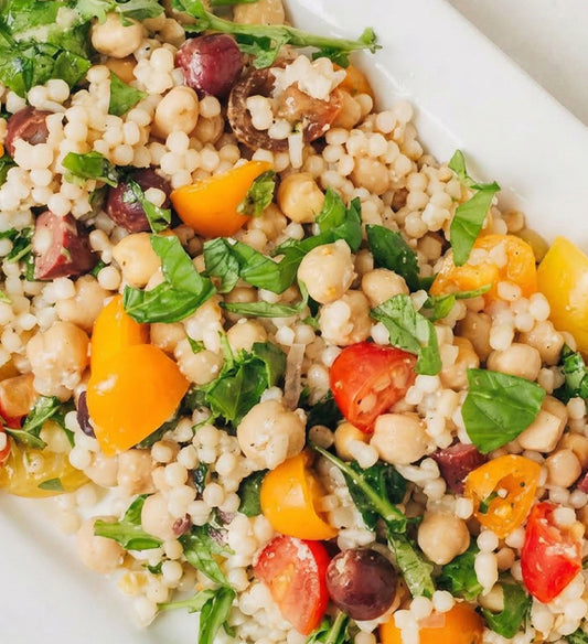 Grilled Vegetable Couscous Pilaf, with Zucchini, Chickpea, Heirloom Tomato, Artichoke Heart, Herbs, and White Balsamic Garlic Vinaigrette