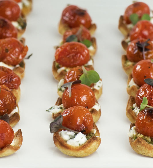 Fire Burst Heirloom Cherry Tomato Tartlet, Garlic Herb Whipped Chevre, and Basil Pesto Pastry Tart