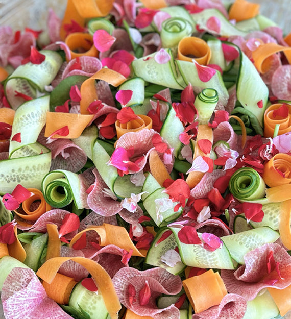 Sunny Warm Weather Salad - Gem Lettuces, Baby Spinach, Carrot Ribbon, Cucumber Curls, Sugar Snap Pea, Watermelon Radish, Edible Flower, and Champagne Vinaigrette