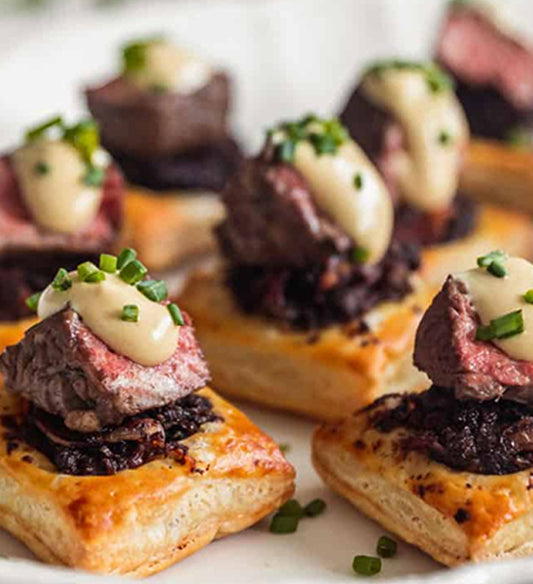 Beef Tenderloin, Caramelized Onion, Gruyere Cheese, and Horseradish Puff Pastry Tart